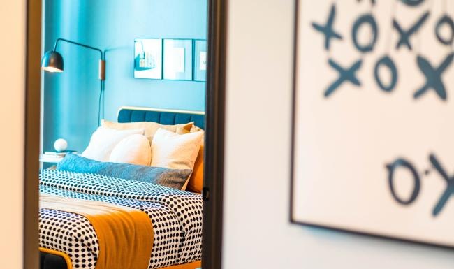 Sleep in style a bedroom with a bed and a lamp