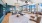 a large room with a large glass wall and a large chandelier