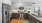a kitchen with white cabinets